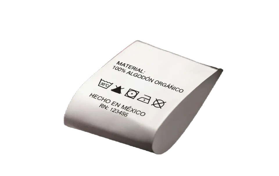 Etiqueta de ropa blanca con instrucciones de lavado y material 100% algodón orgánico, Fabricante: Etimex Digital en Mexico.